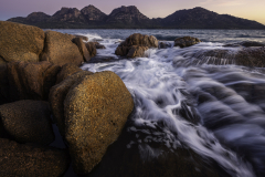 Orange Lichen Rocks with Mountain Backdrop – Tasmania
